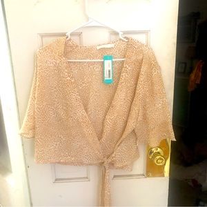 Shirt sleeve wrap around top. Still has the tags!